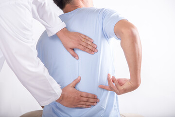Obraz premium Doctor and patient suffering or Chiropractor examining from back pain in clinic. Physical therapy concept.