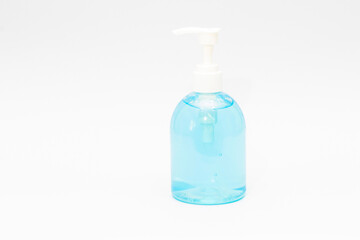 Pressing hand sanitizer on a white background.