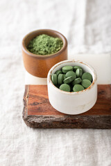 Chlorella tablets and spirulina powder, concept of superfood and detox