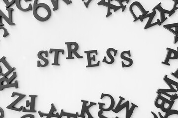 Composition with word STRESS on light background