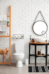 Modern toilet bowl in interior of stylish bathroom