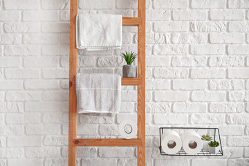 Ladder with towels in bathroom