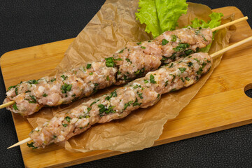 Raw minced pork skewer kebab for grill