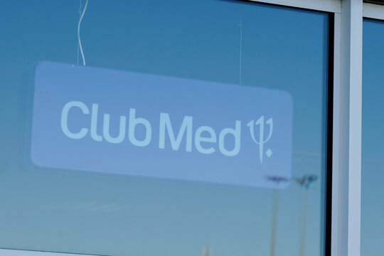 Club Med sign text and logo brand front of office Club Mediterranee shop travel agency for all-inclusive holidays