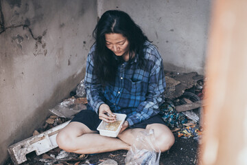 poor people,homeless or beggar begging for help sitting at dirty slum.concept for poverty...