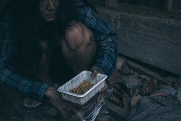 poor people,homeless or beggar begging for help sitting at dirty slum.concept for poverty...