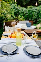 table served in the garden for a family dinner. a romantic dinner