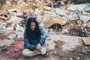 poor people,homeless or beggar begging for help sitting at dirty slum.concept for poverty hunger,human rights,donate and charity for underprivileged children in third world