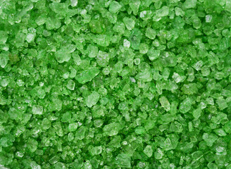 Obraz premium background from bath salts, emerald color. relaxation rest and treatment concept.