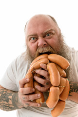 Emotional fat funny and tattooed man with food isolated on a white background