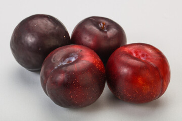 Ripe sweet plum fruit heap