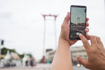hand man taking photo Giant Swing. travel holidays concept.