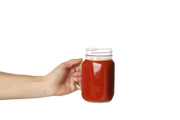 Female hand hold jar of tomato juice, isolated on white background