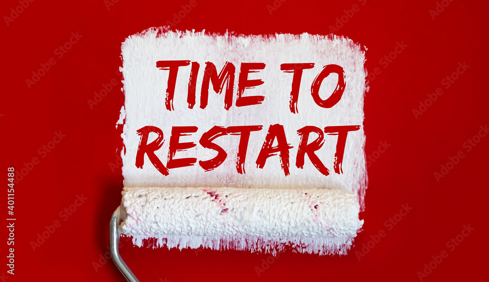 Poster time to restart .one open can of paint with white brush on red background. top view.