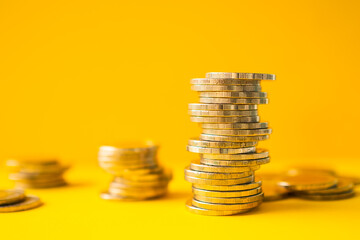 Future plan saving money for 2021 year concept. gold yellow over light with stack coin on yellow...