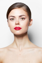 Elegant woman naked shoulders red lips clean skin 