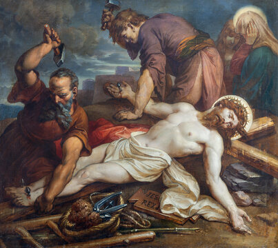 VIENNA, AUSTIRA - OCTOBER 22, 2020: The painting Jesus is nailed to the cross in church St. Johann der Evangelist by Karl Geiger (1876).