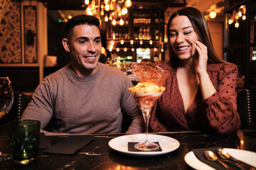 Young couple enjoying a date at restaurant.