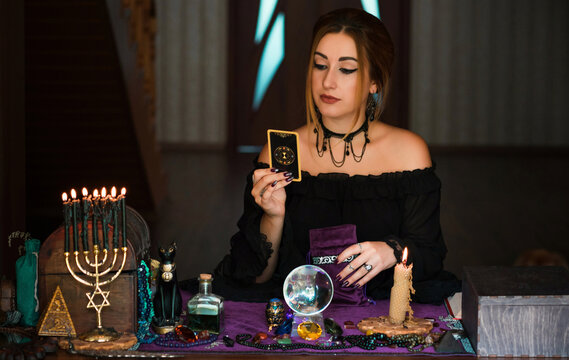 Prediction concept. Old magic, Tarot cards and divination, fortune telling scene