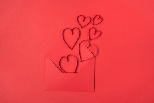 I love you concept. Top above overhead close up view photo of open envelope anf flying away paper hearts isolated bright color monochromatic backdrop