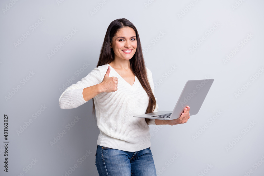 Poster Photo of mature happy positive smiling cheerful woman show thumb-up use laptop isolated on grey color background