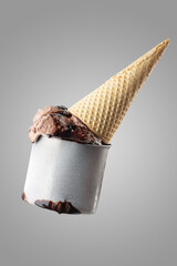Chocolate ice-cream and cone and chocolate topping 