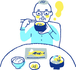 食事をする高齢男性