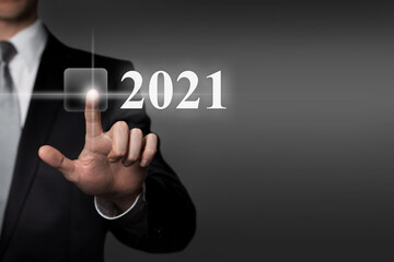 New Year 2021 - hand pressing virtual touchscreen button