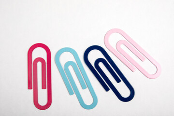 Paper clips on a white background. Stationery