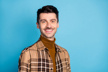Obraz premium Photo of young handsome attractive smiling cheerful businessman freelancer in plaid shirt isolated on blue color background