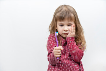 child has pain when brushing teeth