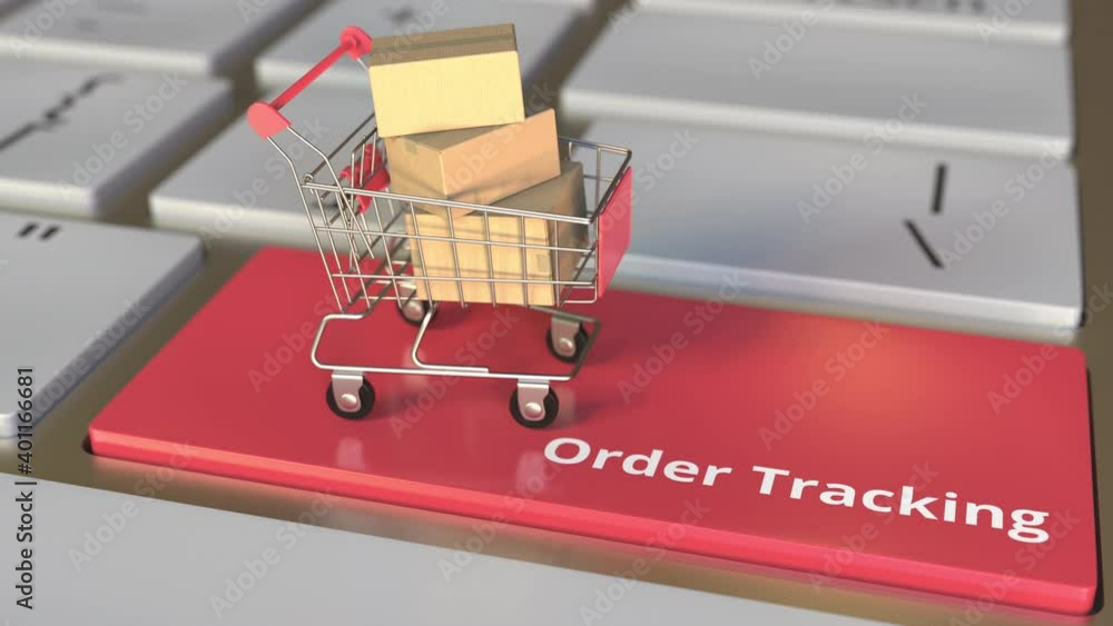 Poster order tracking text on computer keyboard and boxes in small shopping cart. electronic business conce