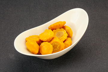 Marinated yellow patisson in the bowl