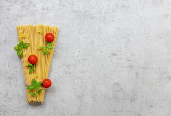 A set of products for delicious italian pasta with tomatoes and basil