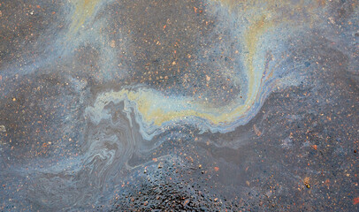 Oil stain on asphalt as texture or background