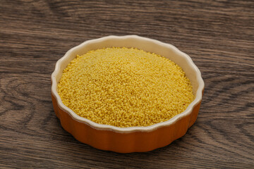 Raw cous cous heap in the bowl