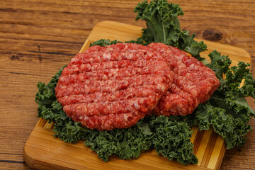 Raw beef burger cutlet for cooking