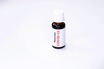 Vaccine against covid 19 in a vial on a white background