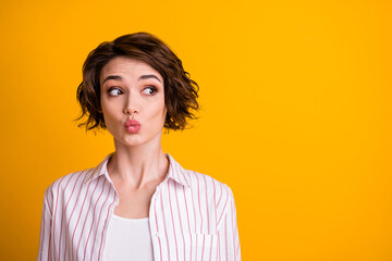 Photo of cute sweet nice lovely surprised girl with her lips pouted plump look copyspace interested novelty secret wear striped shirt outfit isolated over vivid color background