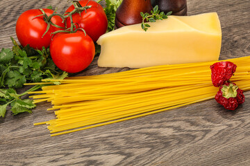 Raw Italian spaghetti heap with cheese