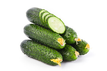 Fresh vegetables: green cucumbers whole and sliced isolated on white background macro close up. 