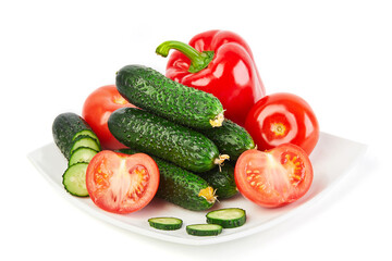 Fresh vegetables: cucumbers, tomatoes and red pepper isolated on white background macro close up. 