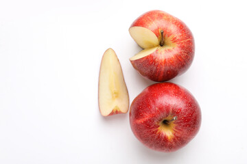 Red apple with slice on white background