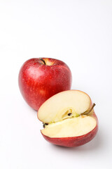 Fototapeta na wymiar Red apple with half slice on white background