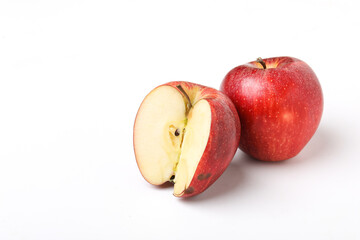 Red apple with half slice on white background