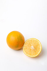 Fresh Half cut sweet lemon or mosambi fruit on white background