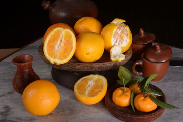 Fresh sunkist citrus fruit on a dark background