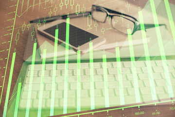 Double exposure of forex chart drawing and cell phone background. Concept of financial trading