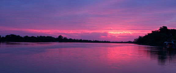 Sunrise over the River Gambia, looking upstream at Georgetown, Gambia.