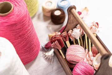 Threads in reels. Colored bobbins for embroidery knitting hobby accessories creativity.